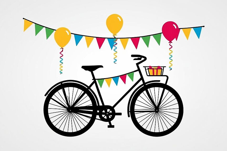 Ein Fahrrad mit bunten Wimpeln und Luftballons Ein Fahrrad mit bunten Wimpeln und Luftballons und einem kleinen Geschenk im Fahrradkorb vorne